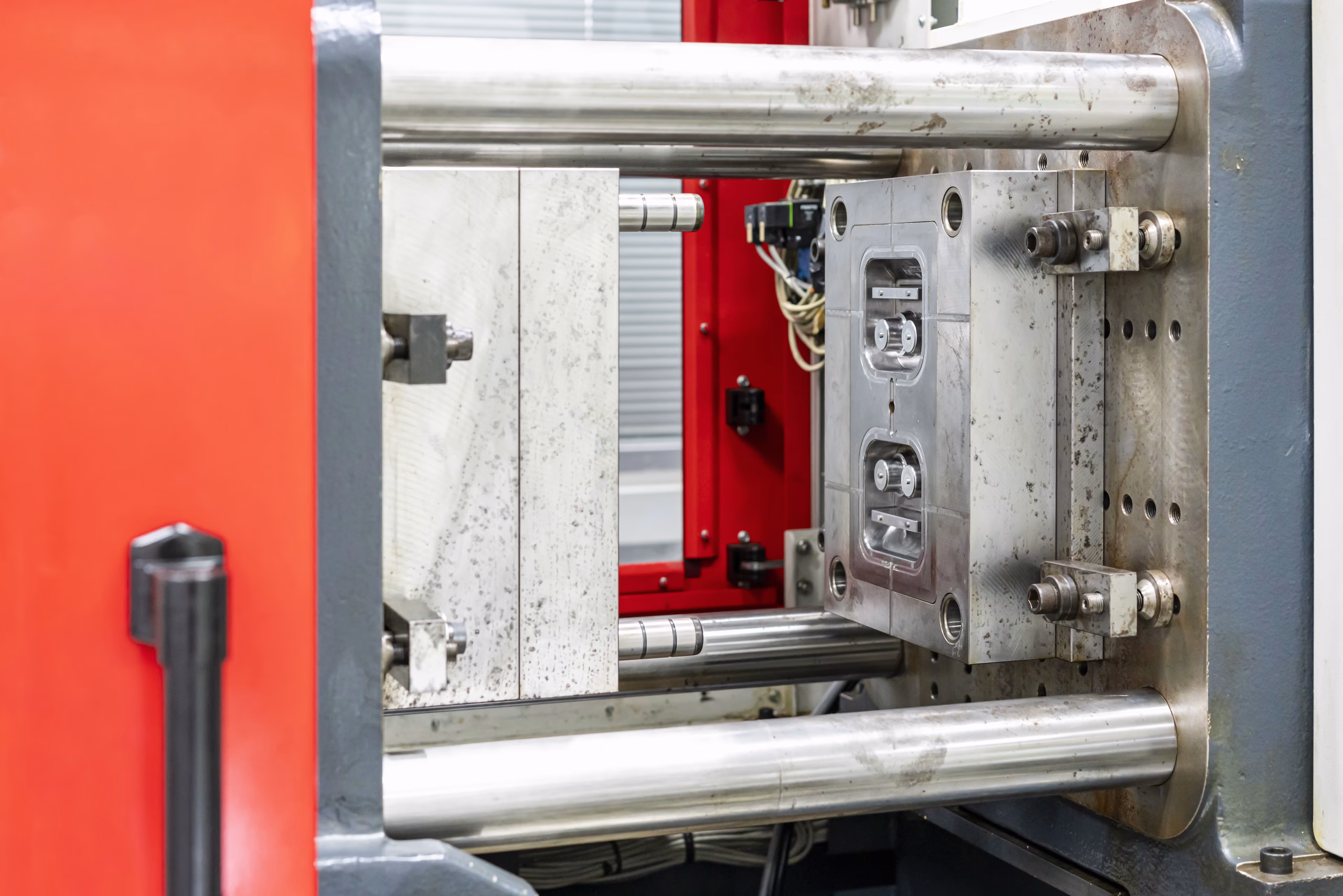 metal mould or plastic injection mold setup on high pressure injection molding machine for mass production or manufacturing in industrial